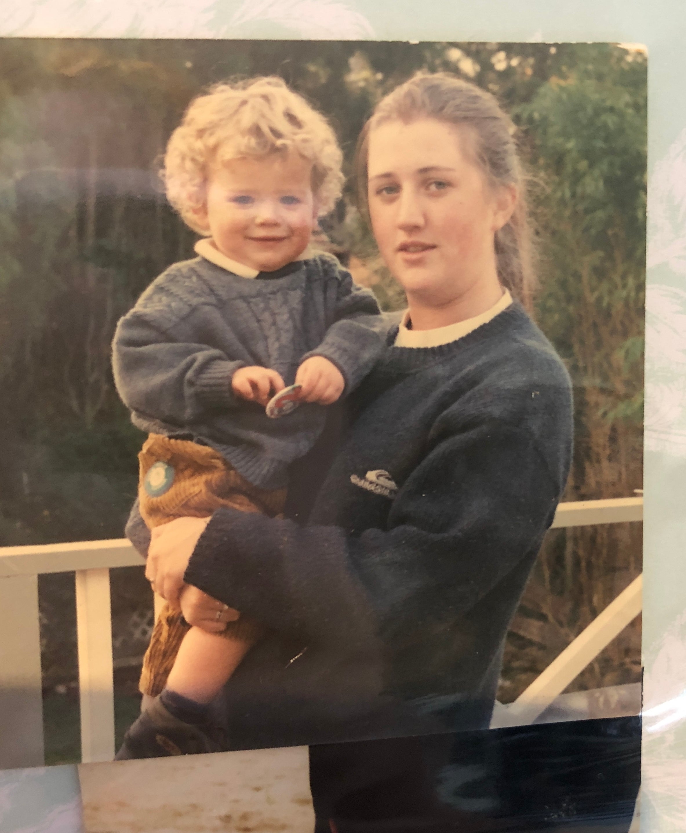 A teenage Sarah holding baby Dan